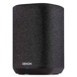 A Denon Home 150 Wireless Speaker in black, featuring a fabric finish and a small blue indicator light at the base, displayed against a white background.