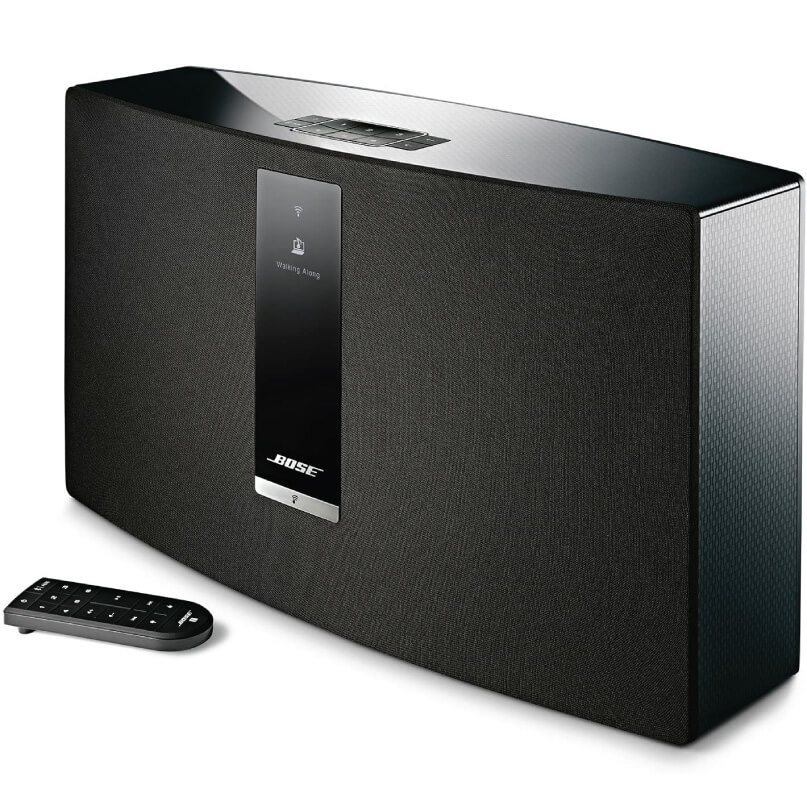 Bose Soundtouch 30 Wireless Music System The bose soundtouch 30 wireless music system, featuring a rectangular design with a digital display and front-facing logo, is displayed alongside a small black remote control on a white background.