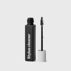Stylus cleaner bottle with attached brush applicator, designed to safely remove dust and debris from turntable needles for improved vinyl sound quality.
