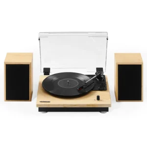 The CROSLEY Brio Record Player Shelf System With Speakers, featuring a clear dust cover and spinning a vinyl record, is accompanied by two wooden speakers with sleek black fronts.
