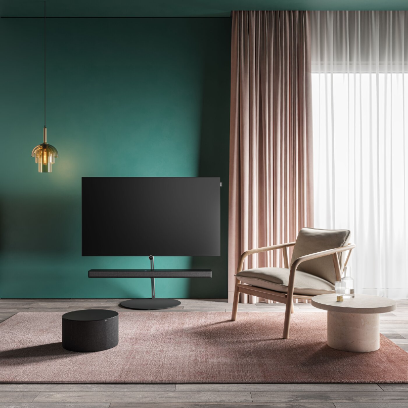 Loewe Klang Bar5 Mr &Amp; Sub5 Soundbar And Subwoofer Loewe klang bar5 mr soundbar and sub5 subwoofer set up in a modern living room with a television and contemporary interior.